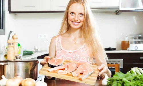 smiling woman with salmon jpg
