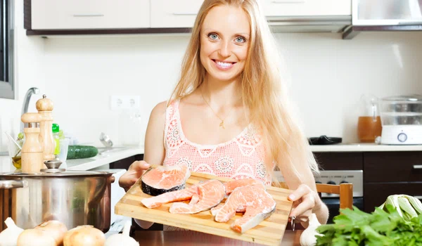 smiling woman with salmon jpg