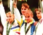 Trei gimnaste din România s-au aflat pe podiumul probei de individual compus: Simona Amânar şi Lavinia Miloşovici şi Gina Gogean; în mijlocul lor e medaliata cu aur, Lilia Podkopaeva din Ukraina (© Guliver/Getty Images)