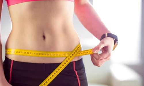 slim woman measuring waist with tape measure 13339 130092 jpeg