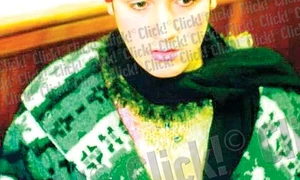 2013: Sorina se bucură  de o masă caldă  la un adăpost  pentru săraci (FOTOGRAFII: RAMONA GĂINĂ) jpeg