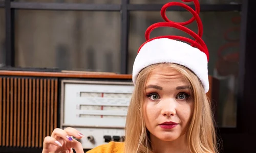 young woman santa s hat sitting with opened book jpg
