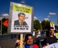 Protest în piața Victoriei față de măsurile de austeritate FOTO Mediafax - pancartă cu Nicușor și creșterea TVA