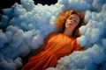 medium shot woman sleeping clouds jpg