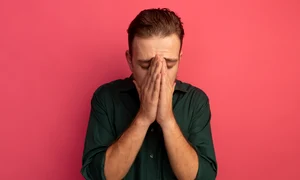disappointed handsome blonde man puts hands face isolated pink wall jpg