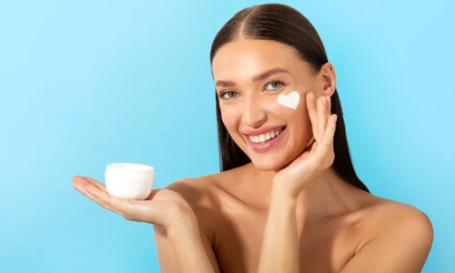 happy lady holding jar applying moisturizing cream enjoy new skin hydration product posing jpg
