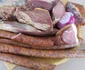 Specialități de Crăciun realizate în urma tăierii porcului la români - cârnați și carne afumate Sursă Muzeul Astra