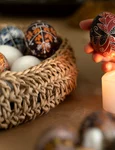 woman decorating easter eggs jpg