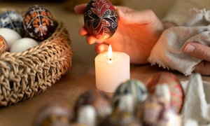 woman decorating easter eggs jpg