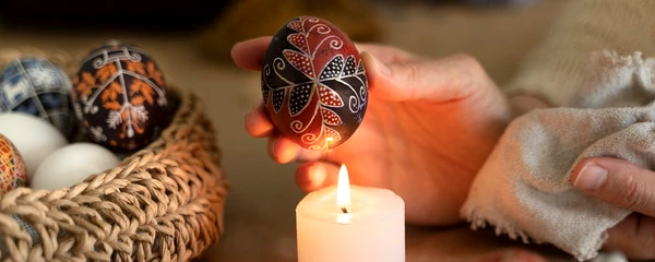 woman decorating easter eggs jpg