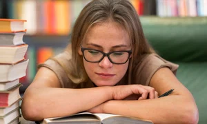 medium shot woman studying library jpg