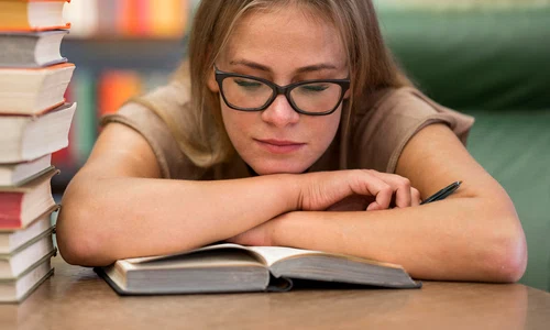 medium shot woman studying library jpg