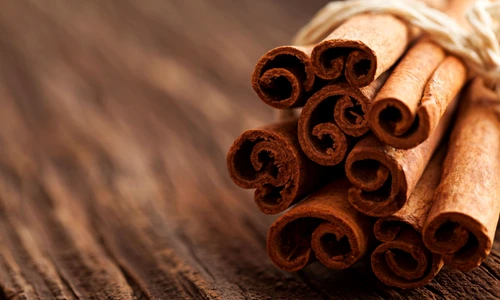 18634193   cinnamon on wood with copy space jpeg