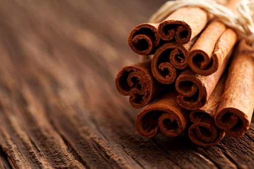 18634193 cinnamon on wood with copy space jpeg