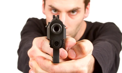 man pointing gun eyes shutterstock 0 jpeg