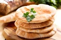 37193281   pita bread on wooden board jpeg