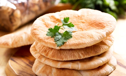 37193281   pita bread on wooden board jpeg