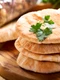 37193281   pita bread on wooden board jpeg