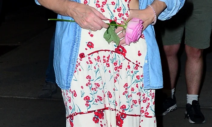 *EXCLUSIVE* Kylie Minogue is all smiles with a pink rose at her NYC hotel jpeg
