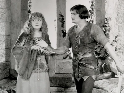 Douglas Fairbanks (Robin Hood) și Enid Bennett (Lady Marian). Scenă din filmul american „Robin Hood”, din 1922 (© United Artists / Wikimedia Commons)