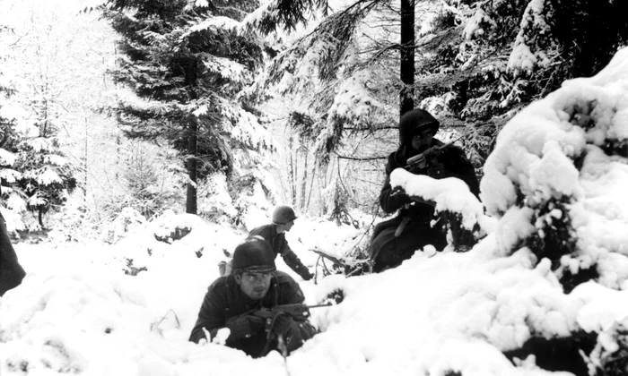 American 290th Infantry Regiment infantrymen fighting in snow during the Battle of the Bulge jpg