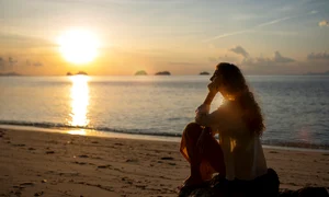 full shot woman spending day alone beach jpg