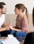 happy smiling young couple holding hands consulting psychologist planning wedding jpg
