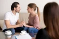 happy smiling young couple holding hands consulting psychologist planning wedding jpg