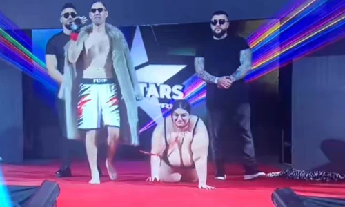 Costică Prisecaru, în lesă cu Emilia Bejan. Captură YouTube