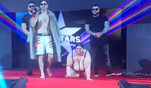 Costică Prisecaru, în lesă cu Emilia Bejan. Captură YouTube