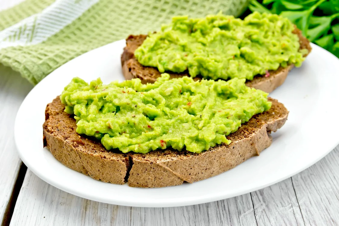 35973827 sandwich with guacamole on light board jpeg