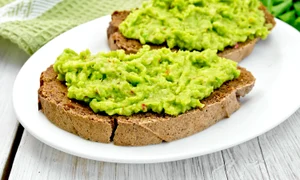35973827   sandwich with guacamole on light board jpeg