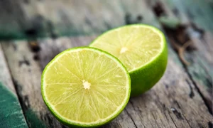 Fresh limes on wooden background jpeg