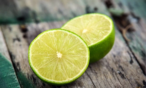 Fresh limes on wooden background jpeg