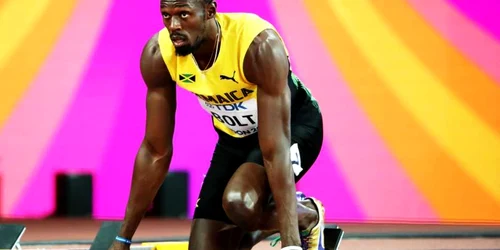 Atletul jamaican Usain Bolt se pregăteşte de startul probei de 100 de metri de la Campionatul Mondial IAAF Londra. FOTO EPA