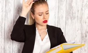 front view young businesswoman strict clothes black jacket holding files documents white surface jpg