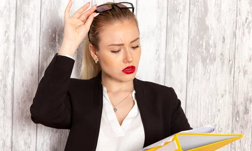 front view young businesswoman strict clothes black jacket holding files documents white surface jpg