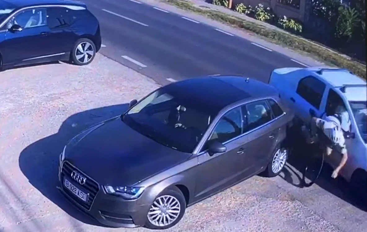 
    Momentul în care biciclistul Alex Filip este prins între două mașini  