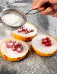 top view delicious cranberry cakes baked yummy getting sugar powder with red cranberries top grey desk cake biscuit sugar sweet jpg