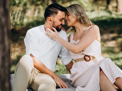 young couple having picnic forest jpg