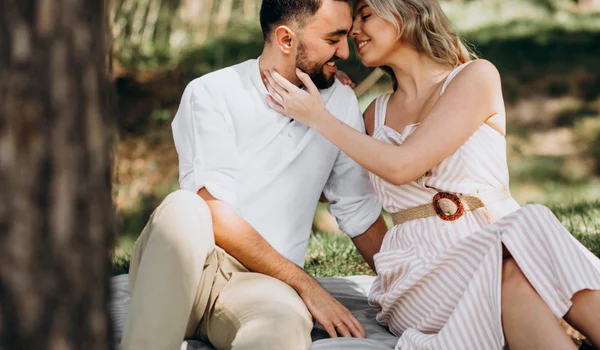young couple having picnic forest jpg