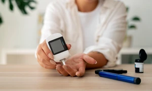 diabetic person checking their glucose level jpg