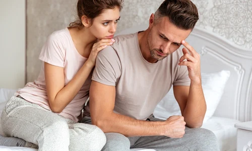 lovely couple sitting bed while woman calm down her boyfriend which upset jpg