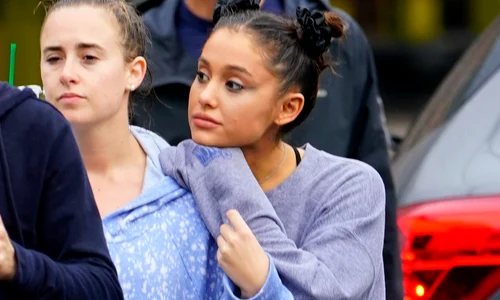 Ariana Grande takes a break from thinking about ex Mac Miller as she walks in the rain with her friends and go to the park to enjoy coffee in New York jpeg