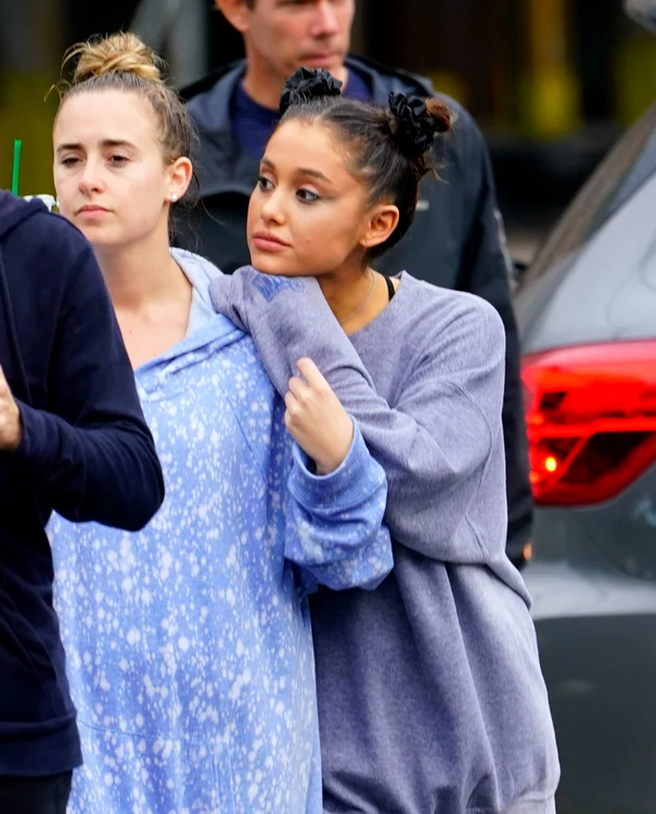 Ariana Grande takes a break from thinking about ex Mac Miller as she walks in the rain with her friends and go to the park to enjoy coffee in New York jpeg