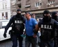 Persoane sunt aduse de către polițiști la sediul Direcției Generale de Poliție a Municipiului București în dosarul legat de violențele de la protestul din Piața Victoriei din data de 15 septembrie 2026  Inquam Photos / George Călin