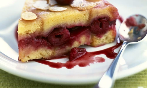 Cherry brioche style cake topped with thinly sliced almonds jpeg