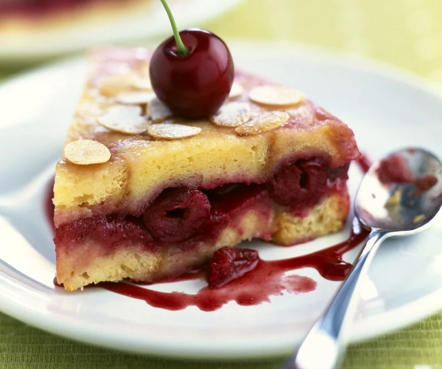 Cherry brioche style cake topped with thinly sliced almonds jpeg