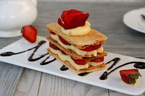51347563 strawberries mille feuille cake in white plate jpeg