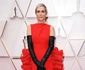 Vedeta din Bridesmaids, Kristen Wiig, a ales o rochie îndelung comentată, model lasagna, de la Valentino Haute Couture şi pantofi Christian Louboutin jpeg